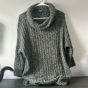 Multi colored stitched turtle neck sweater with slit in sides. Medium fits an XL